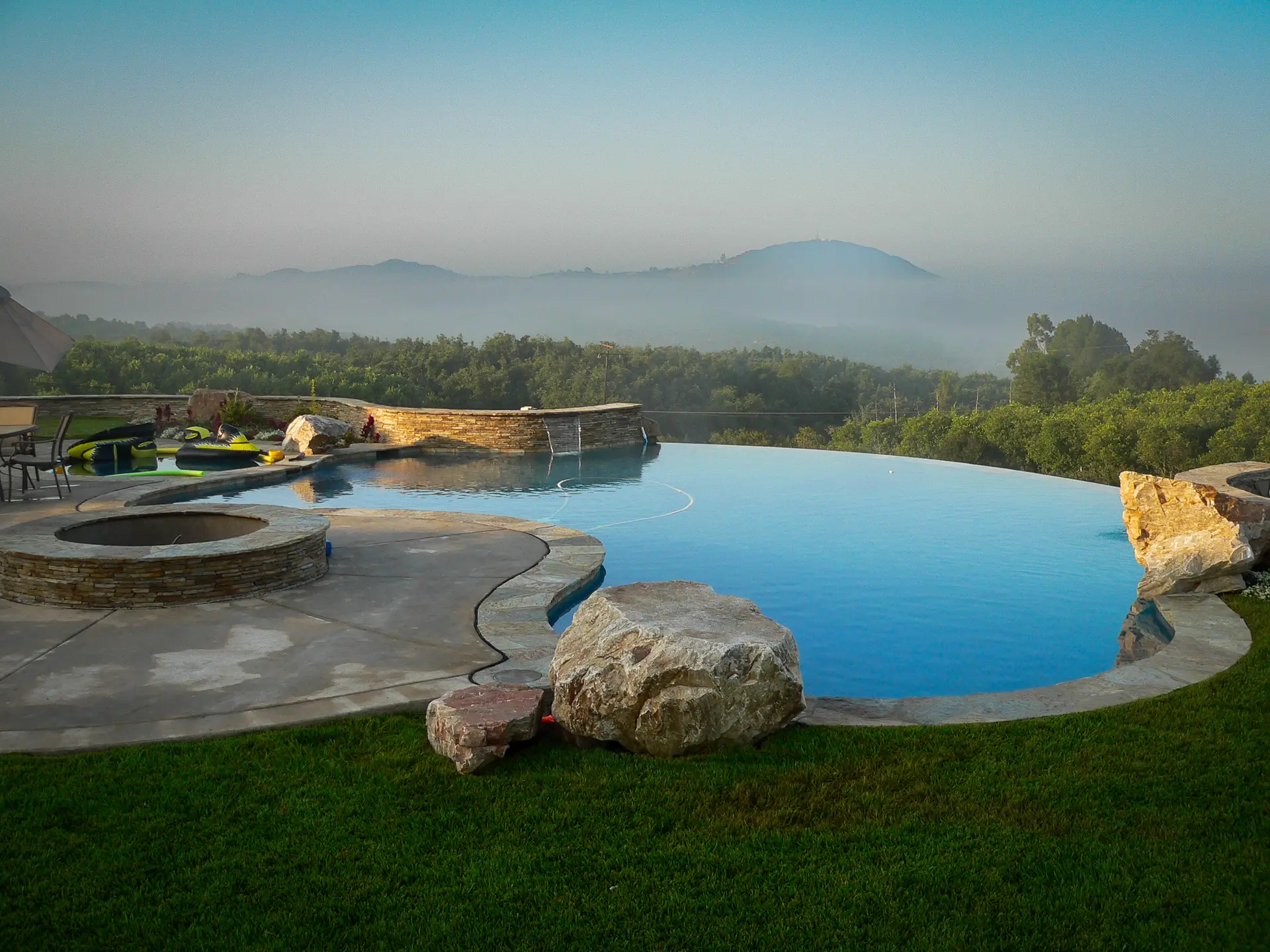 Backyard pool with modern landscaping and hardscape