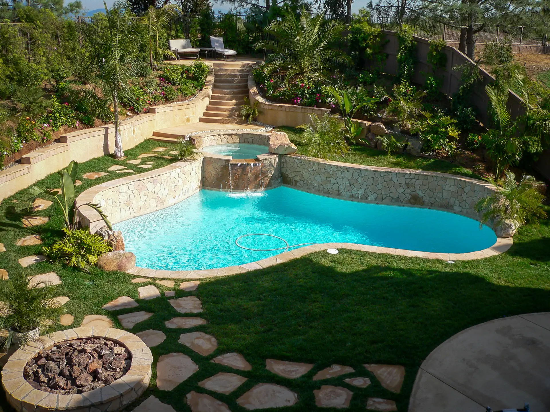 Custom free-form pool with natural stone accents
